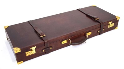 Lot 12 - A leather double gun case with brass fittings,...