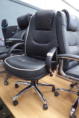 Lot 4456 - Black leatherette upholstered swivel office...