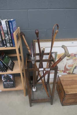 Lot 5020 - Oak stick stand with walking and shooting sticks