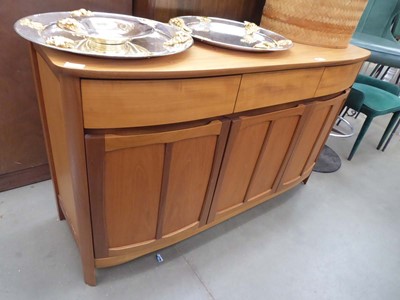 Lot 5272 - Bow fronted teak sideboard with three drawers...