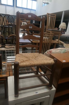 Lot 5093 - Elm ladderback rocking chair with rush seat