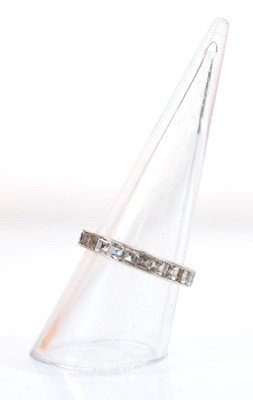 Lot 501 - A white metal full eternity ring set princess...