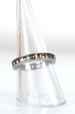 Lot 501 - A white metal full eternity ring set princess...