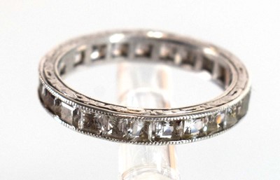 Lot 501 - A white metal full eternity ring set princess...