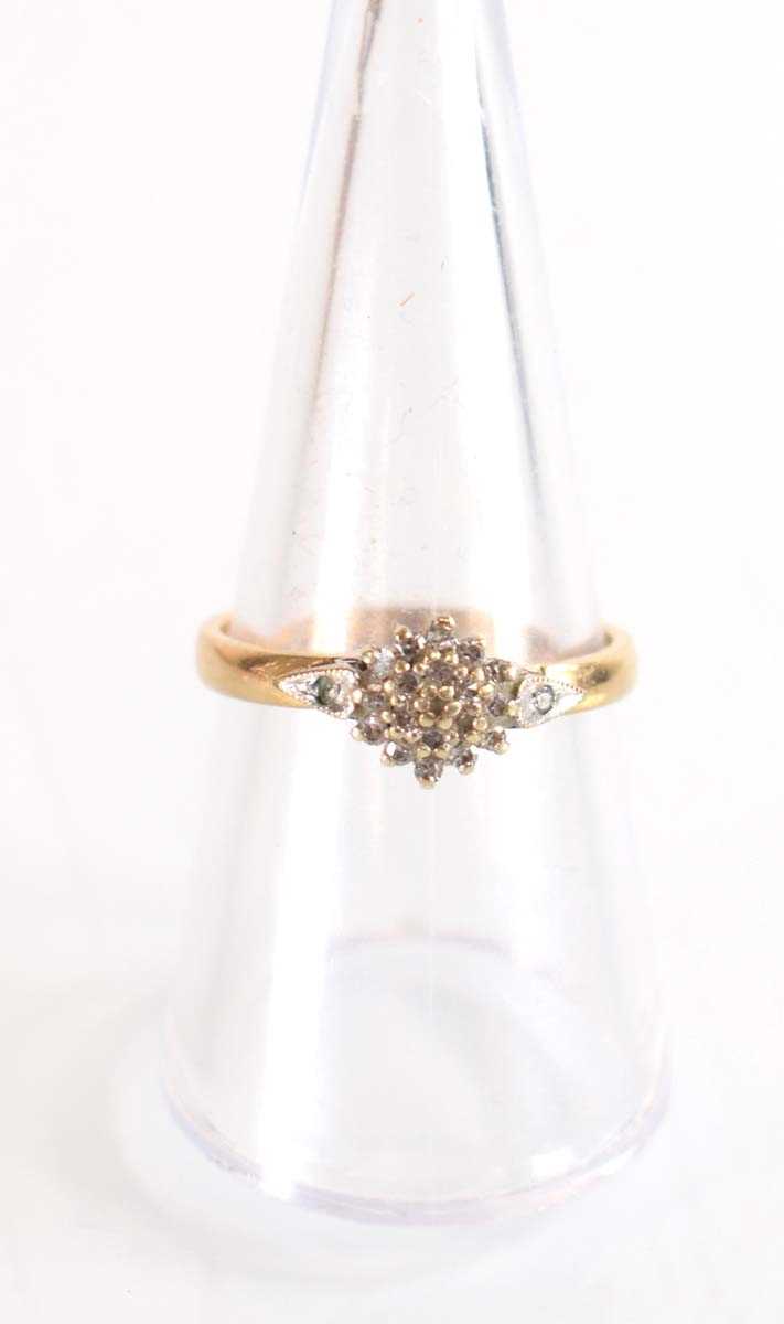 Lot 507 - A 9ct yellow gold cluster ring set small...