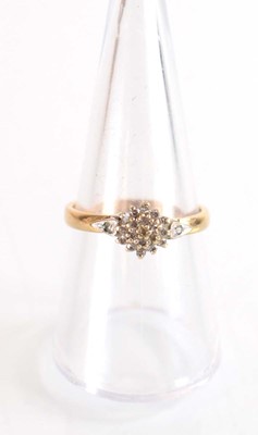 Lot 507 - A 9ct yellow gold cluster ring set small...