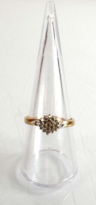 Lot 507 - A 9ct yellow gold cluster ring set small...