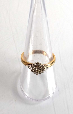 Lot 507 - A 9ct yellow gold cluster ring set small...