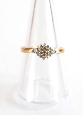 Lot 507 - A 9ct yellow gold cluster ring set small...