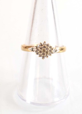 Lot 507 - A 9ct yellow gold cluster ring set small...
