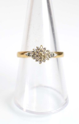 Lot 507 - A 9ct yellow gold cluster ring set small...