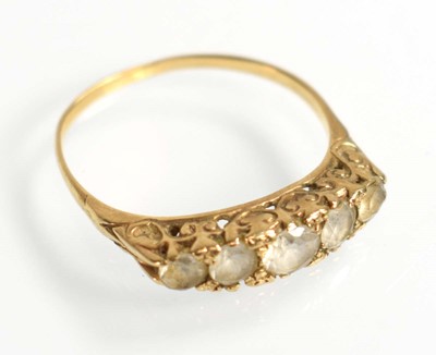 Lot 509 - A yellow metal ring set five graduated clear...