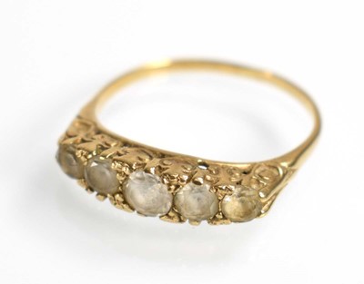 Lot 509 - A yellow metal ring set five graduated clear...