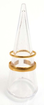 Lot 510 - A 22ct yellow gold wedding band, London 1934,...