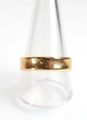 Lot 515 - Two 9ct yellow gold wedding bands and a yellow...
