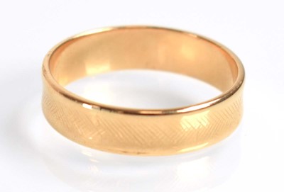 Lot 515 - Two 9ct yellow gold wedding bands and a yellow...