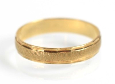 Lot 515 - Two 9ct yellow gold wedding bands and a yellow...