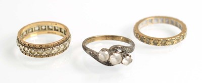 Lot 517 - Two 9ct yellow gold and yellow metal eternity...