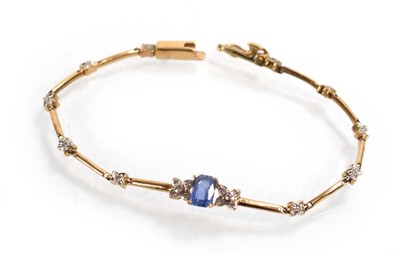 Lot 521 - A yellow metal tennis type bracelet set small...
