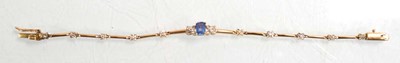 Lot 521 - A yellow metal tennis type bracelet set small...