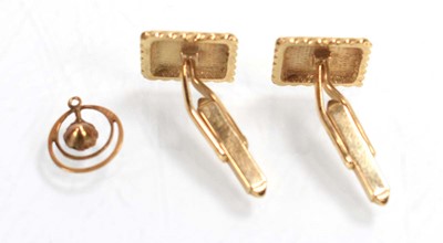 Lot 523 - A pair of 9ct yellow gold cufflinks of square...