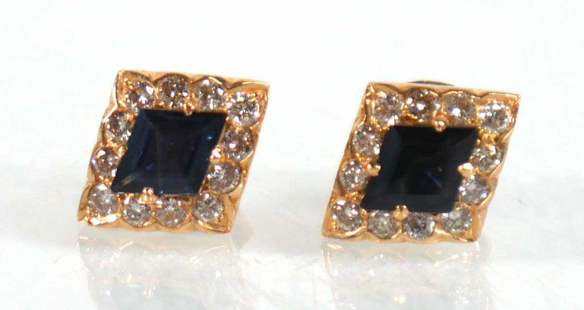 Lot 524 - A pair of yellow metal ear studs, each set a...