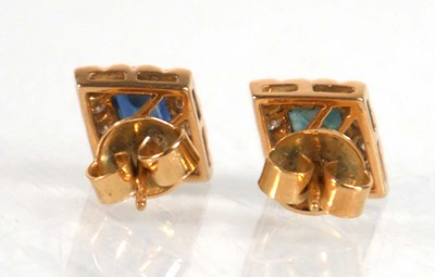 Lot 524 - A pair of yellow metal ear studs, each set a...