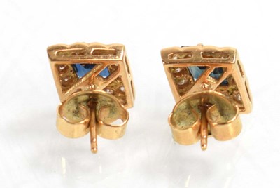 Lot 524 - A pair of yellow metal ear studs, each set a...