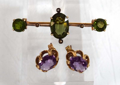 Lot 525 - A pair of 9ct yellow gold eat studs, each set...