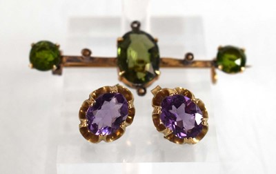 Lot 525 - A pair of 9ct yellow gold eat studs, each set...