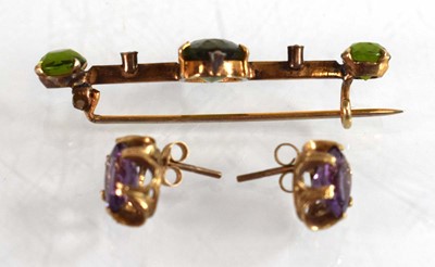 Lot 525 - A pair of 9ct yellow gold eat studs, each set...