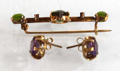Lot 525 - A pair of 9ct yellow gold eat studs, each set...