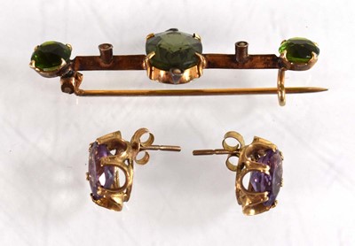 Lot 525 - A pair of 9ct yellow gold eat studs, each set...