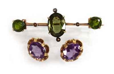 Lot 525 - A pair of 9ct yellow gold eat studs, each set...