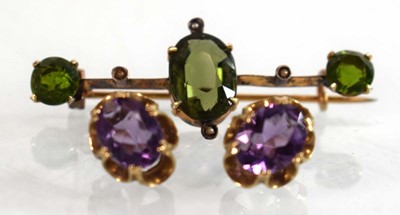 Lot 525 - A pair of 9ct yellow gold eat studs, each set...