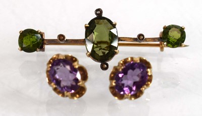 Lot 525 - A pair of 9ct yellow gold eat studs, each set...
