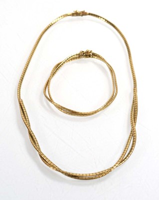 Lot 534 - A 9ct yellow gold engraved articulated...