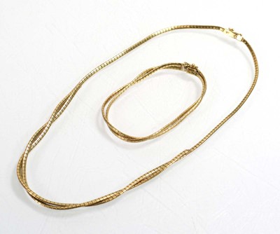 Lot 534 - A 9ct yellow gold engraved articulated...