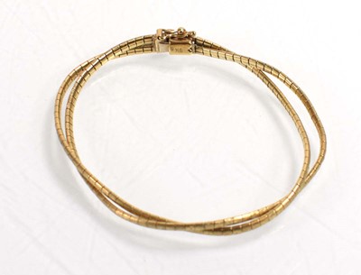 Lot 534 - A 9ct yellow gold engraved articulated...