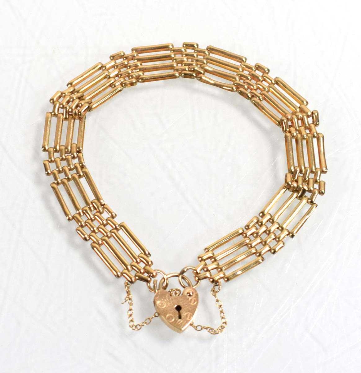 Lot 536 - A 9ct yellow gold four bar gatelink bracelet...