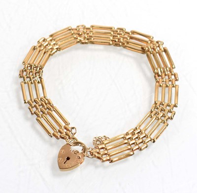 Lot 536 - A 9ct yellow gold four bar gatelink bracelet...