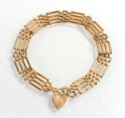 Lot 536 - A 9ct yellow gold four bar gatelink bracelet...