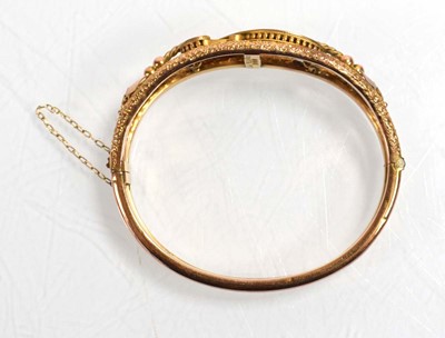 Lot 541 - An Edwardian 9ct yellow gold hollow hinged...