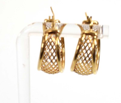 Lot 542 - A pair of 9ct yellow gold ear hoops of trellis...