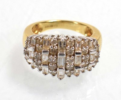Lot 544 - An 18ct yellow gold ring set eleven rows of...