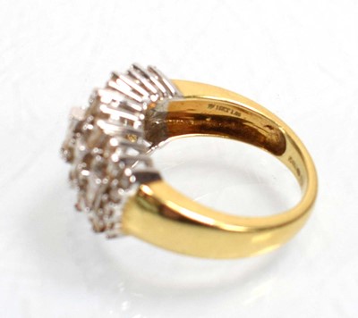 Lot 544 - An 18ct yellow gold ring set eleven rows of...