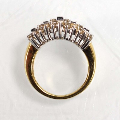 Lot 544 - An 18ct yellow gold ring set eleven rows of...
