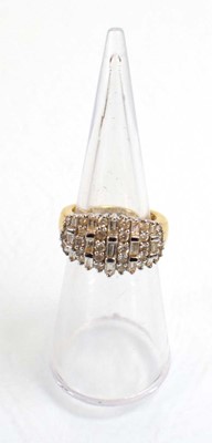 Lot 544 - An 18ct yellow gold ring set eleven rows of...