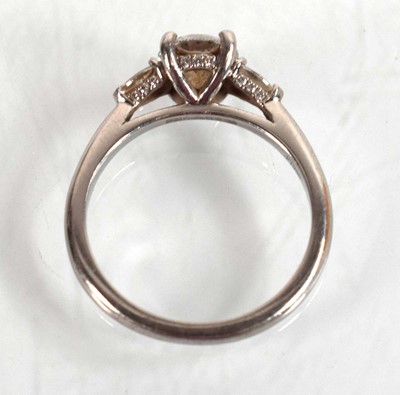 Lot 547 - A platinum ring set brilliant cut lab grown...