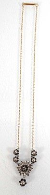 Lot 548 - An early 20th century 9ct yellow gold...